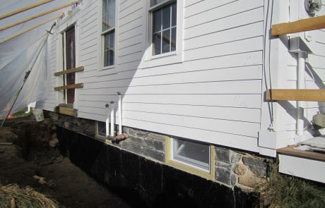 #7 Stone Foundation Built & Windows Installed.